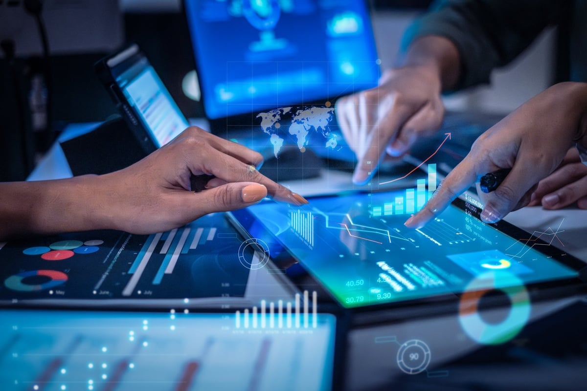 close up hand team of financial discussion fintech technology planning, analyzing digital financial data and strategy in a modern office